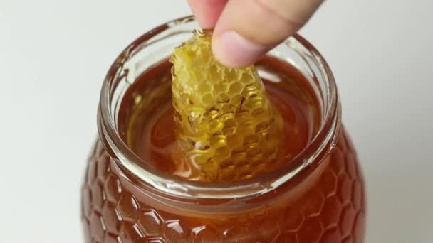 Closeup Anonymous Person Taking Piece Honeycomb Dripping Honey Glass Jar — Stock Video