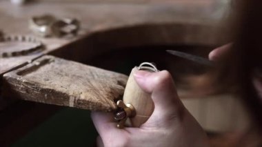 woman making handmade jewelry