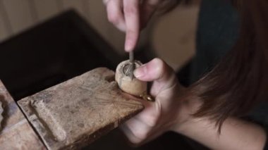 woman making handmade jewelry