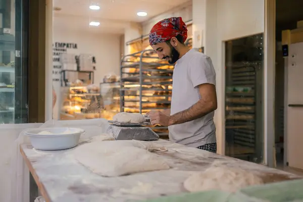 Young Arabic Baker Dressed White Clothes Red Hat Cutting Dough — Stock Photo, Image