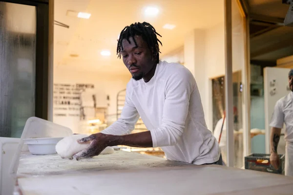 Young Black Baker Dressed White Shirt Holds Dough His Hands — Stock Photo, Image