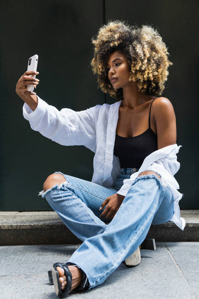 Full Body African American Female Trendy Casual Outfit Sitting Concrete — Stock Photo, Image