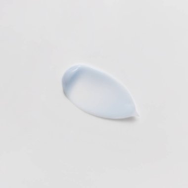 Blue beauty cream smear smudge on white background. Cosmetic skincare product texture. Face cream, body lotion swipe swatch