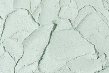 Güzellik kremi dokusu. Yeşil kozmetik maske arka planı. Kremalı cilt ürünleri yakın çekim