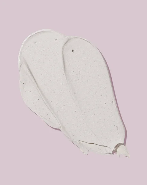 Beżowa Maska Rozmazana Różowym Tle Tekstura Produktu Kosmetycznego Pielęgnacji Skóry — Zdjęcie stockowe