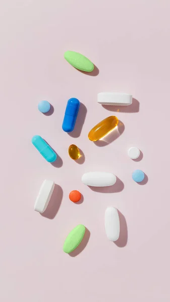 ピンクの背景に多くの異なるカラフルな薬や薬 — ストック写真