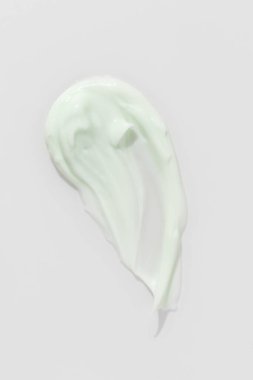 Yeşil güzellik kremi lekesi. Kozmetik cilt ürünü dokusu. Kaydırma kumaşı. 