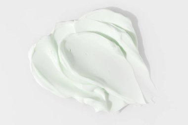 Yeşil güzellik kremi lekesi. Kozmetik cilt ürünü dokusu. Kaydırma kumaşı. 