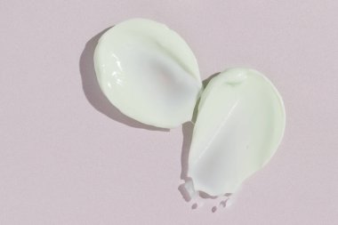 Yeşil güzellik kremi lekesi. Kozmetik cilt ürünü dokusu. Kaydırma kumaşı