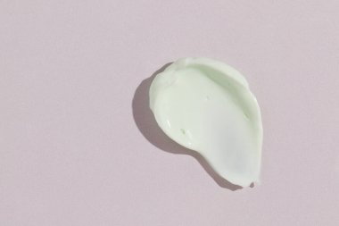 Yeşil güzellik kremi lekesi. Kozmetik cilt ürünü dokusu. Kaydırma kumaşı