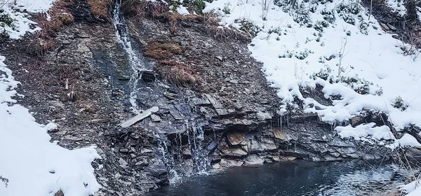 waterfall in the mountains. waterfall in winter.