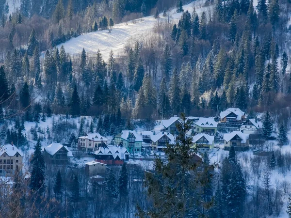 winter mountain village. the village in the mountains
