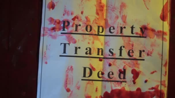 Vista Superior Papéis Property Transfer Deed Deitado Chão Com Sangue — Vídeo de Stock