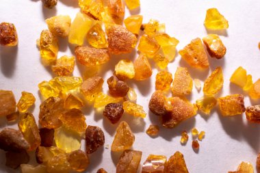 amber, amber pebbles on a white background