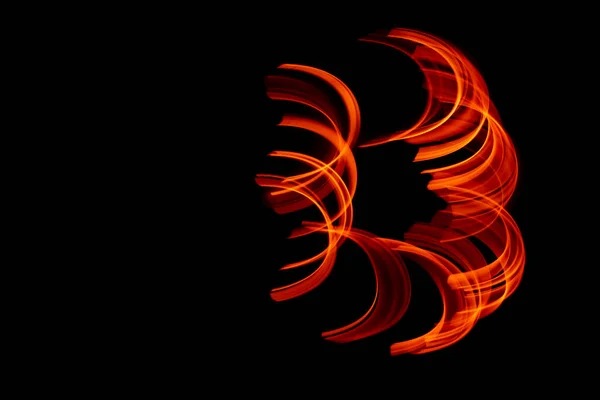 burning in motion. lines of fire in the dark