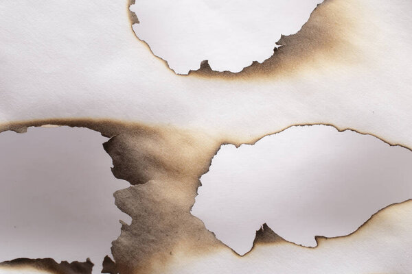 burning paper, glowing edge of paper on a white  background