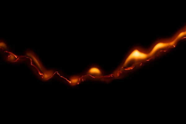 Yanan kağıt, parlayan kağıt kenarı siyah arkaplan üzerinde