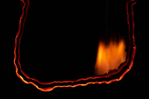 Burning Paper Glowing Edge Paper Black Background — Stock Photo, Image