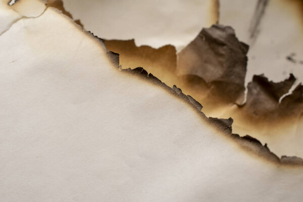 scorched sheets of white paper