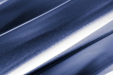 bent metal sheet with visible texture. background