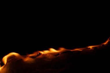 Yanan kağıt, parlayan kağıt kenarı siyah arkaplan üzerinde