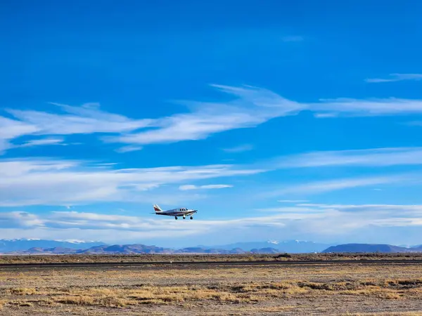 airplane flying in the sky at the beach