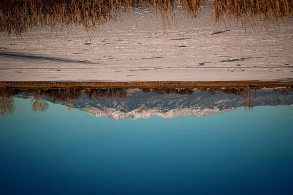 reflection of a water surface on the river shore, lake baikal