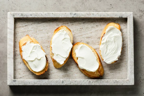 Toasted Baguette Slices Cream Cheese Breakfast Marble Tray — Stock Photo, Image