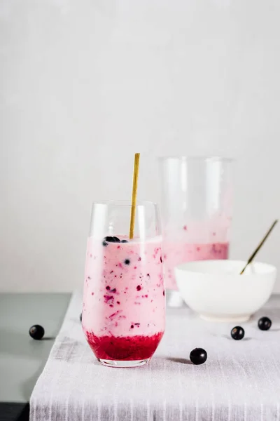 stock image Blackcurrant smoothie with natural yogurt in a glass. Healthy food concept.