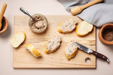 Homemade liver pate spread on baguette slices.