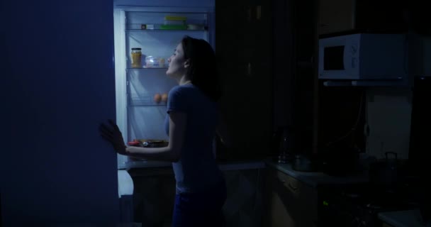 Woman Opens Refrigerator Night Takes Bottle Water — Stock Video