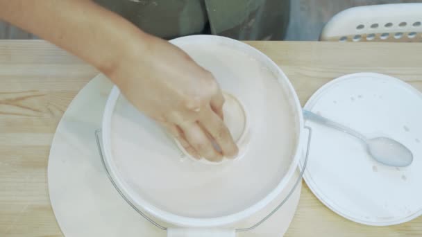 Female Hand Dips Clay Product Glaze Paint Top View — Stock Video
