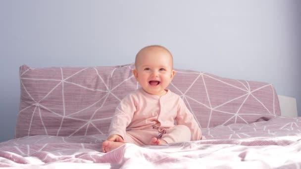Sweet Funny Baby Sitting Bed Laughing Waving His Head Real — Stock Video