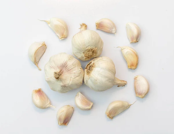 Garlic bulbs on black background, close-up. Organic garlic top view. Food background. Selective focus