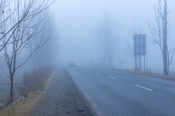 Thick fog in swat valley with low traffic