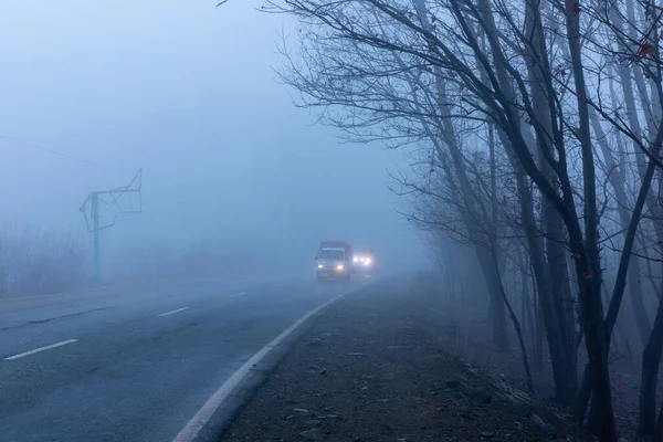Vehicles on road in a foggy bad weather in swat valley, Pakistan