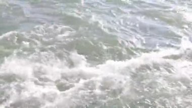 Powerful rapid in the river with speedy water in motion
