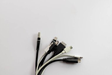 Charging cables of various types of ports on white isolated background