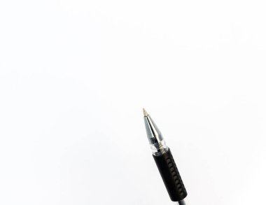 Closeup of a black ball pen tip on white background