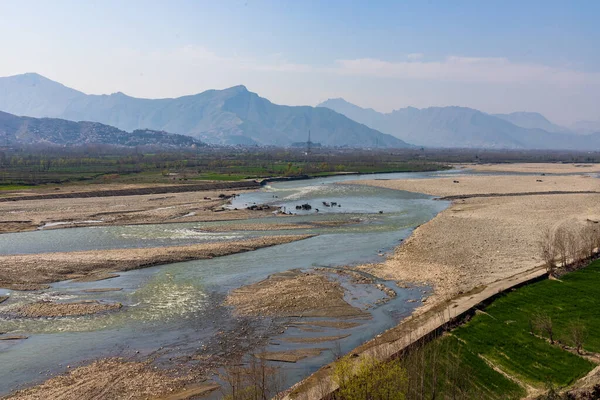 stock image Picturesque view of river and fields in spring in the countryside of Pakistan