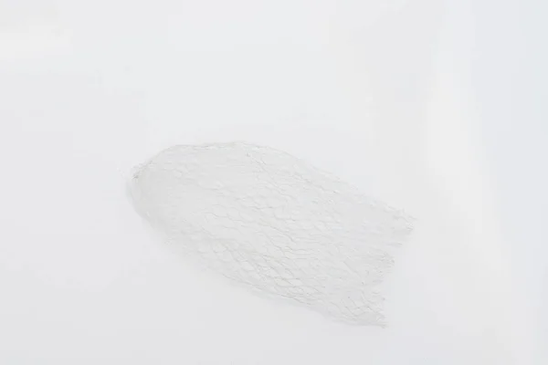 stock image Plastic mesh net protective packaging netting sleeve isolated on white background