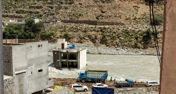 stock image Abandoned building sunken and damaged by the flood water at river bank of swat river in Bahrain valley: Bahrain swat, Pakistan - June 12, 2023.