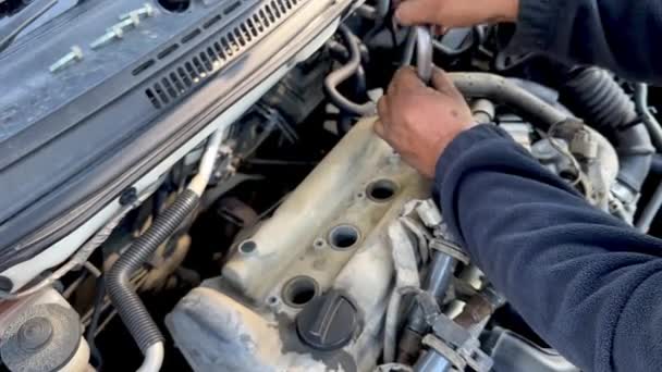 Close Mechanic Man Hands Tightening Spark Plug Engine — Stock Video