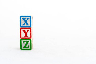 XYZ alphabets blocks stacked and isolated on white background with copy space. clipart