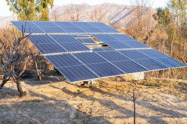 Solar panels in agriculture farm for generating renewable energy to use for irrigation in Pakistan clipart