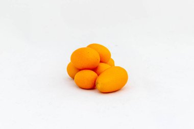 Ripe kumquats isolated on white background with copy space. clipart