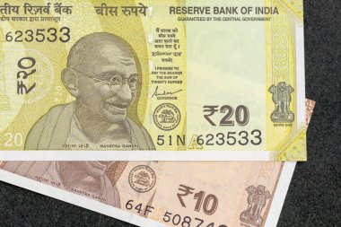 Mahatma Gandhi on new twenty and ten rupees bank note: Pakistan - 07 July 2024. clipart