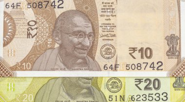 Closeup of India new 20 and 10 currency banknotes: Pakistan - 07 July 2024. clipart