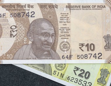 India ten and twenty rupees currency notes closeup: Pakistan - 07 July 2024. clipart