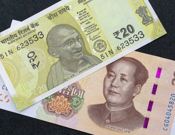 stock image Close-Up of Indian Rupee and Chinese Yuan Banknotes